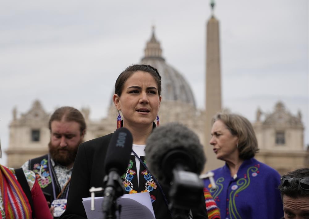 FILE - President of the Metis community, Cassidy Caron, speaks to the media in St. Peter's Square after their meeting with Pope Francis at The Vatican, Monday, March 28, 2022. The restitution of Indigenous and colonial-era artifacts, a pressing debate for museums and national collections across Europe, is one of the many agenda items awaiting Francis on his trip to Canada, which begins Sunday. (AP Photo/Gregorio Borgia, File )